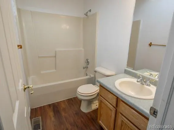 a bathroom with a sink toilet and a mirror