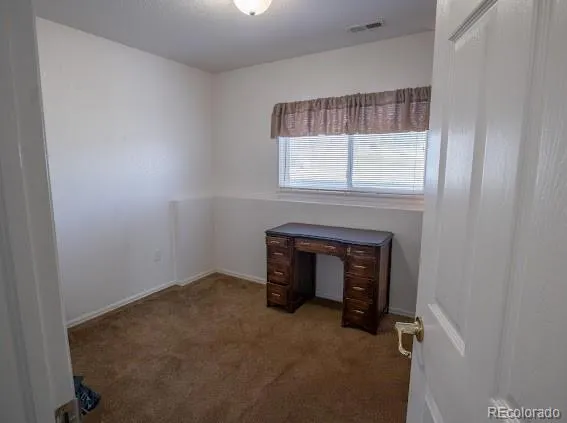 a room with a fireplace and a window