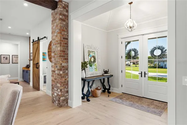 a view of livingroom with furniture window and front door