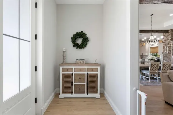 a bedroom with a bed and a night stand