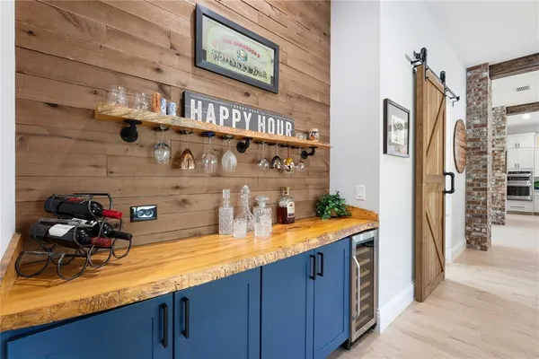 a bedroom with furniture and a flat screen tv