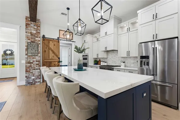 a view of walk in closet with clothes