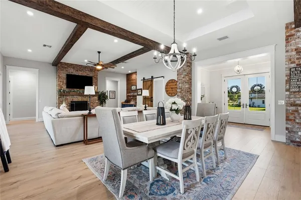 a bathroom with a double vanity sink toilet mirror and shower
