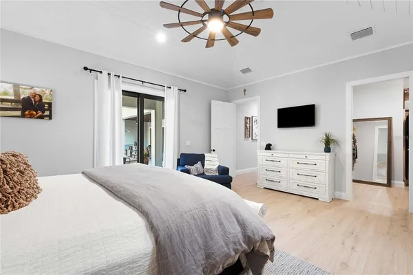 a view of a patio with couches table and chairs and potted plants