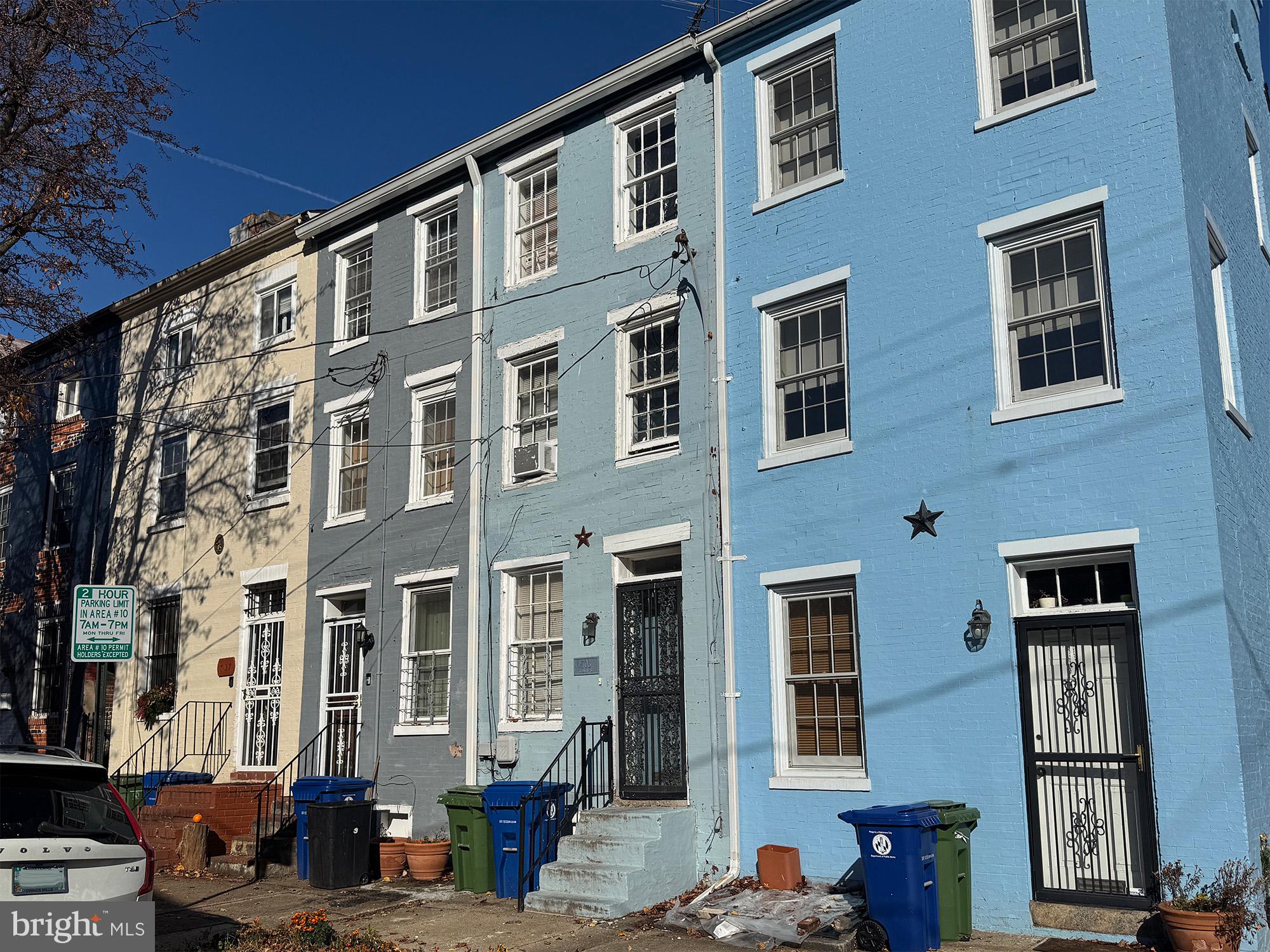 703 Tessier Street Baltimore, MD 21201 - Photo 2 of 11 a front view of a building with a lot of windows