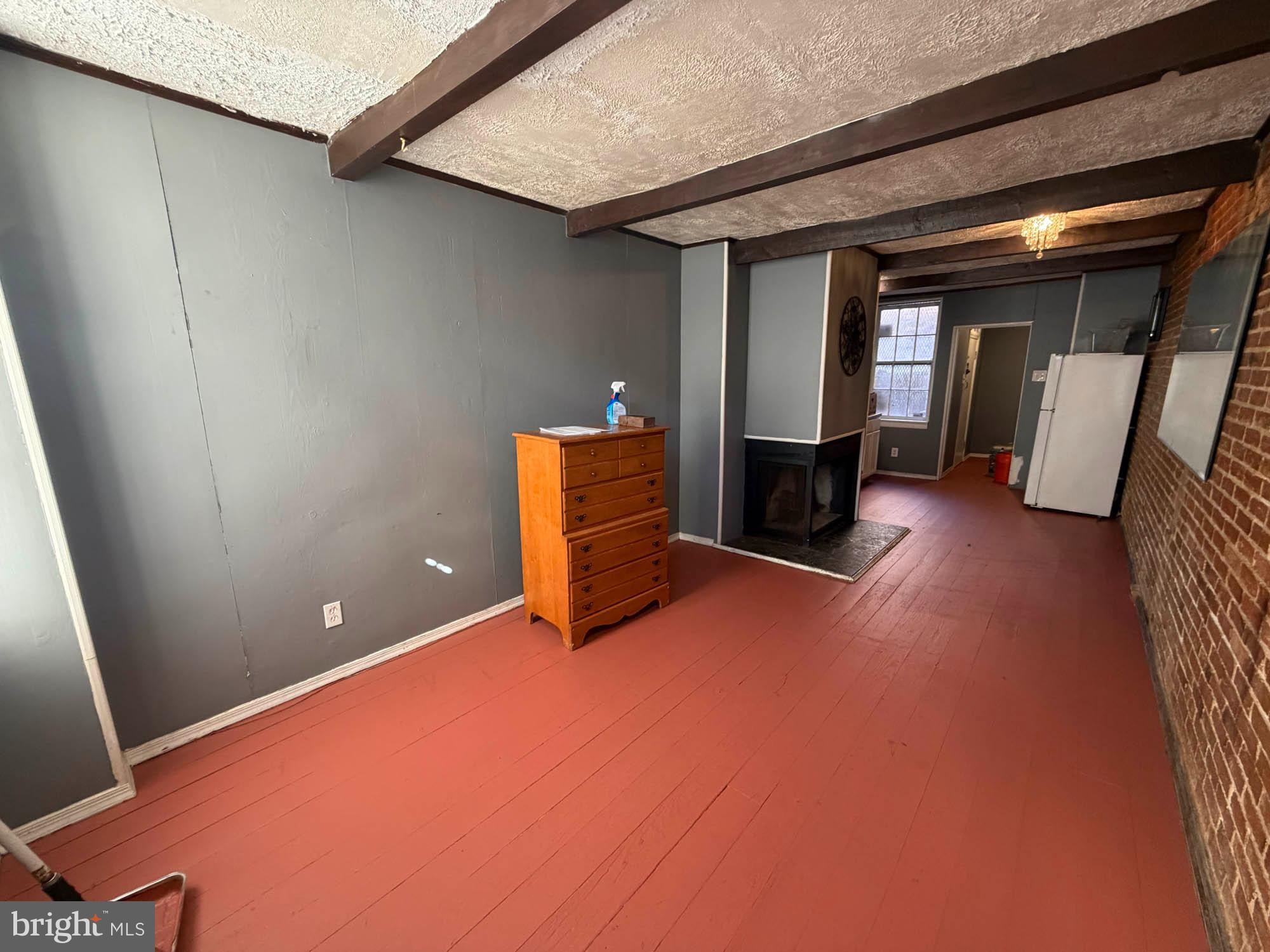 703 Tessier Street Baltimore, MD 21201 - Photo 3 of 12 a view of a livingroom with furniture and staircase