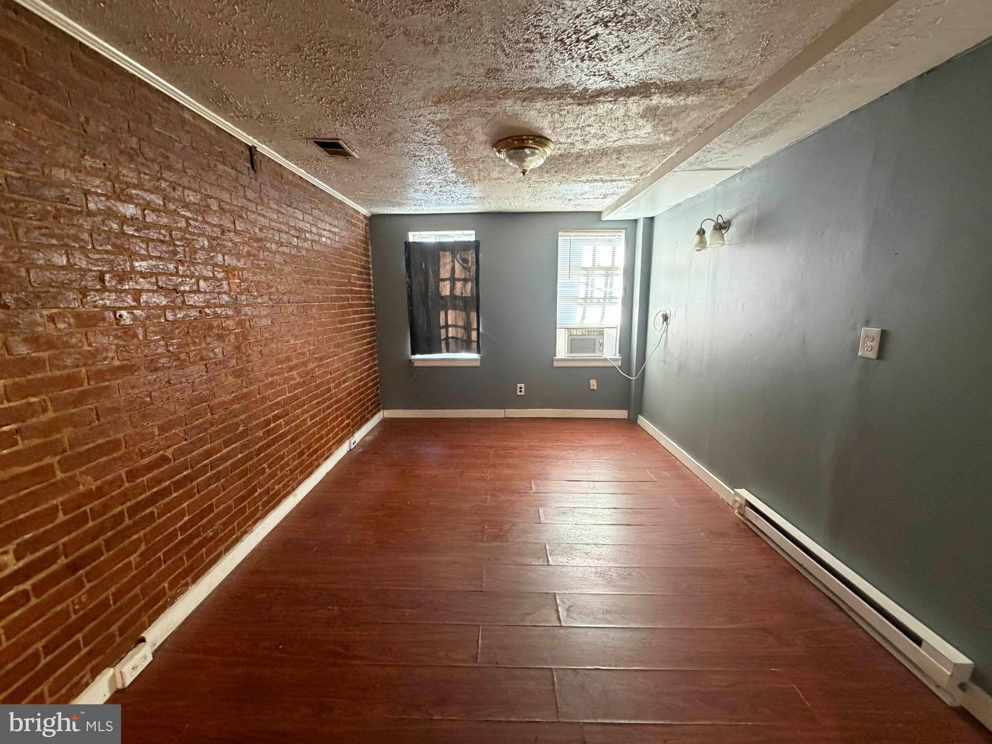 703 Tessier Street Baltimore, MD 21201 - Photo 6 of 12 a view of livingroom with window