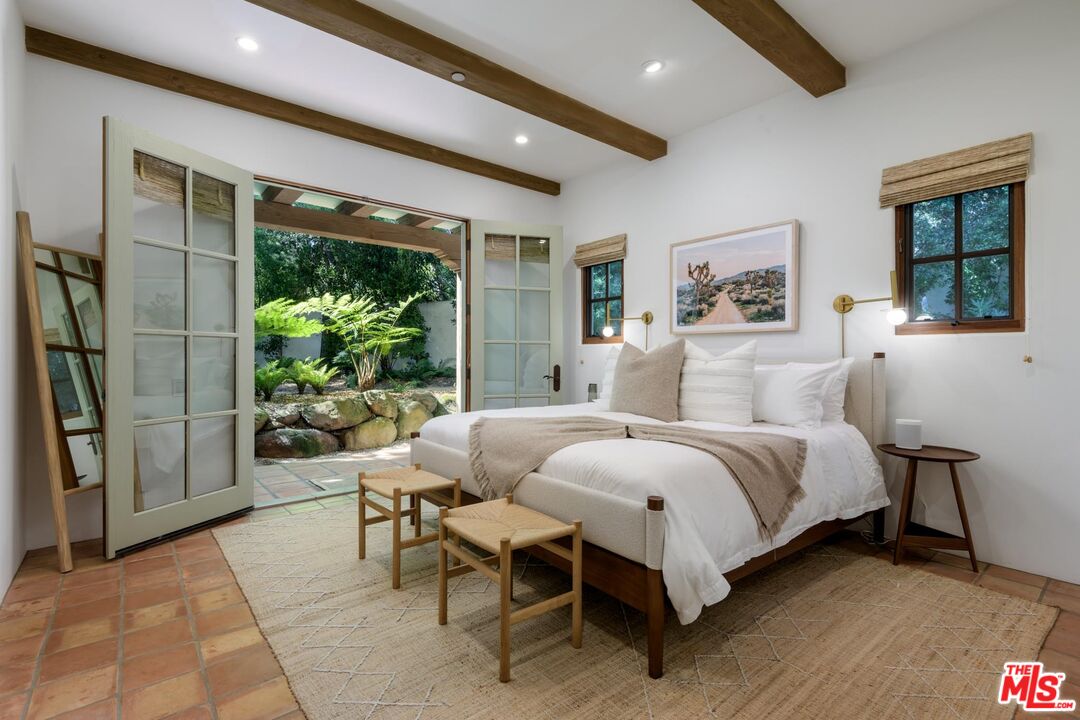 849 Ashley Road Montecito, CA 93108 - Photo 12 of 28 a bedroom with a bed and a painting on the wall
