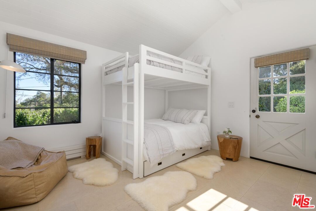 849 Ashley Road Montecito, CA 93108 - Photo 25 of 28 a bedroom with a bed and a large window