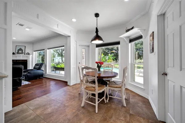 a dining room with furniture and window