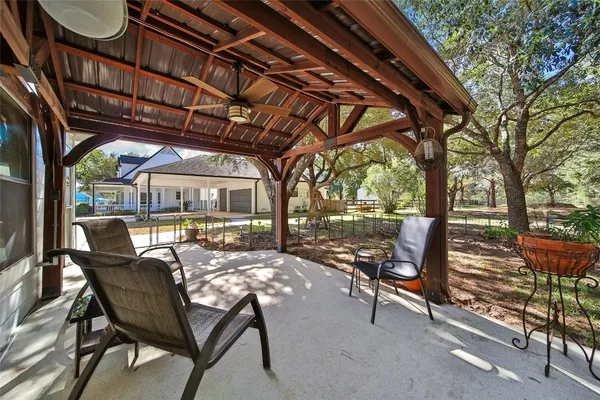 a view of a chairs and table in the patio