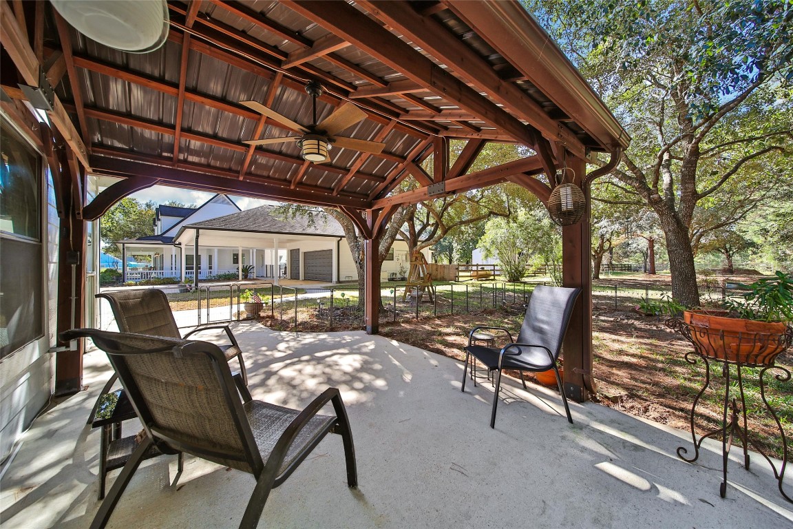 29919 Tudor Way Magnolia, TX 77355 - Photo 36 of 50 a view of a chairs and table in the patio