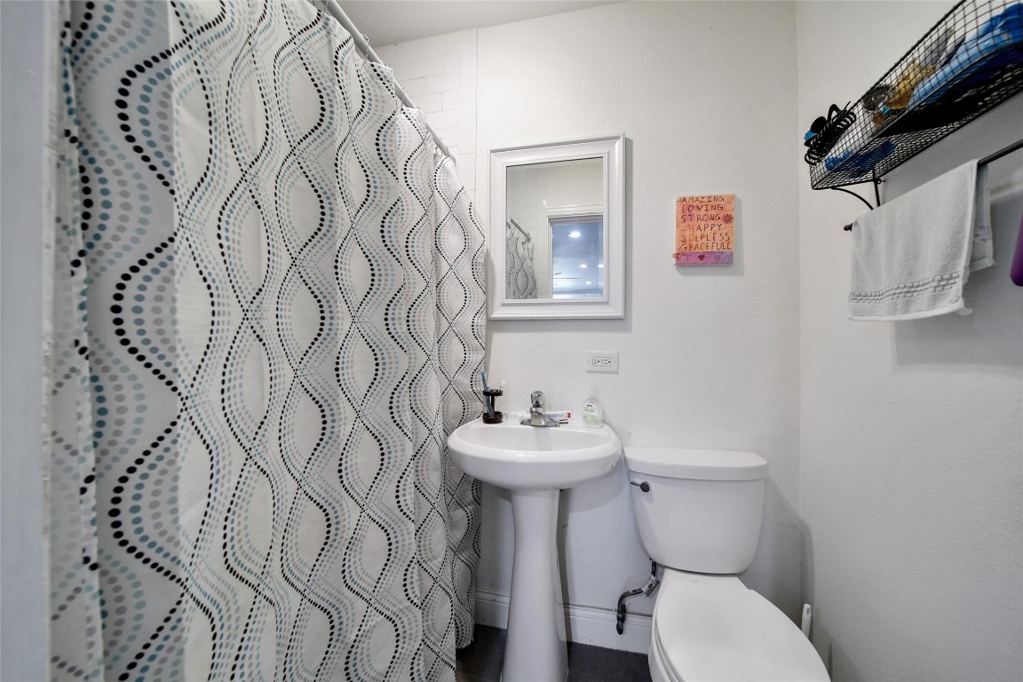 29919 Tudor Way Magnolia, TX 77355 - Photo 46 of 50 a bathroom with a sink toilet and a mirror
