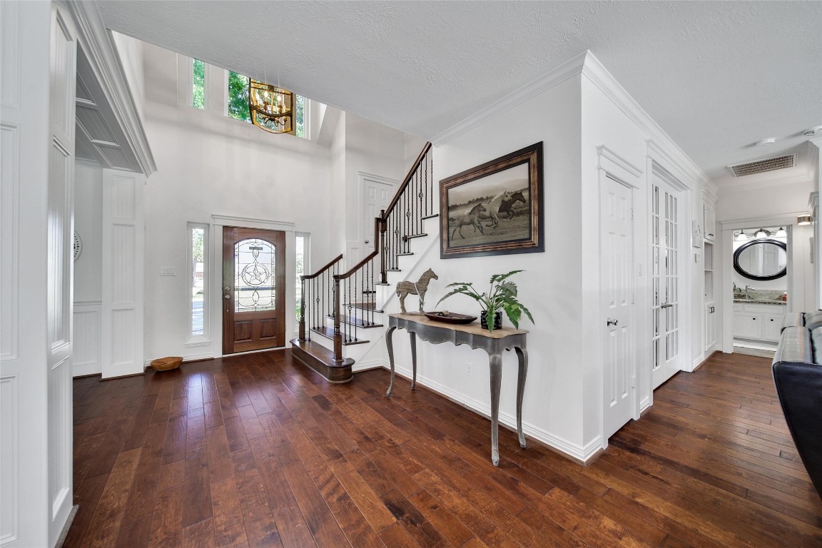 29919 Tudor Way Magnolia, TX 77355 - Photo 7 of 50 a view of an entryway with wooden floor and windows