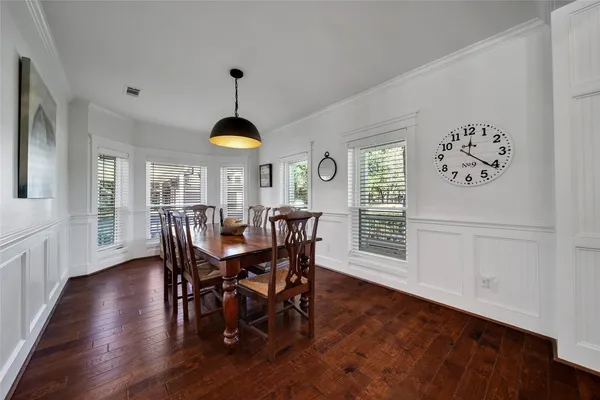 a dining room with furniture window wooden floor