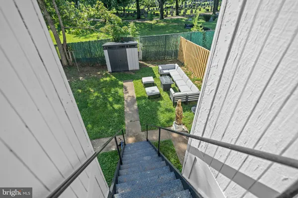 a view of balcony with wooden floor and outdoor seating