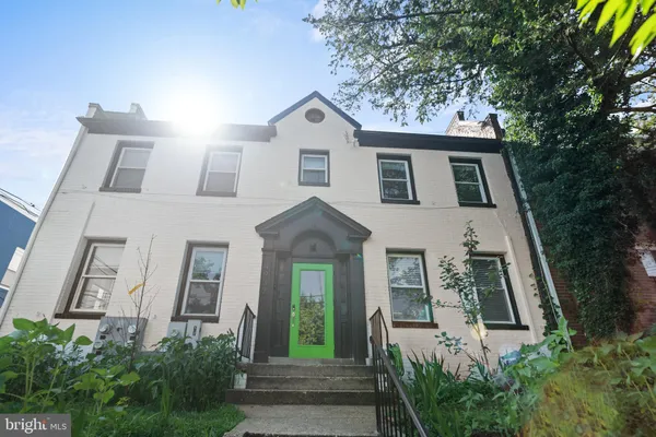 a view of a front of a house with a small yard