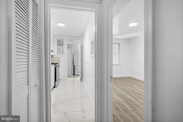 a view of a bathroom from a hallway