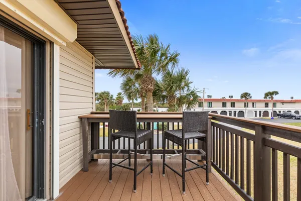 a view of a chairs and table on the deck