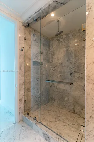 a bathroom with a bathtub and a shower