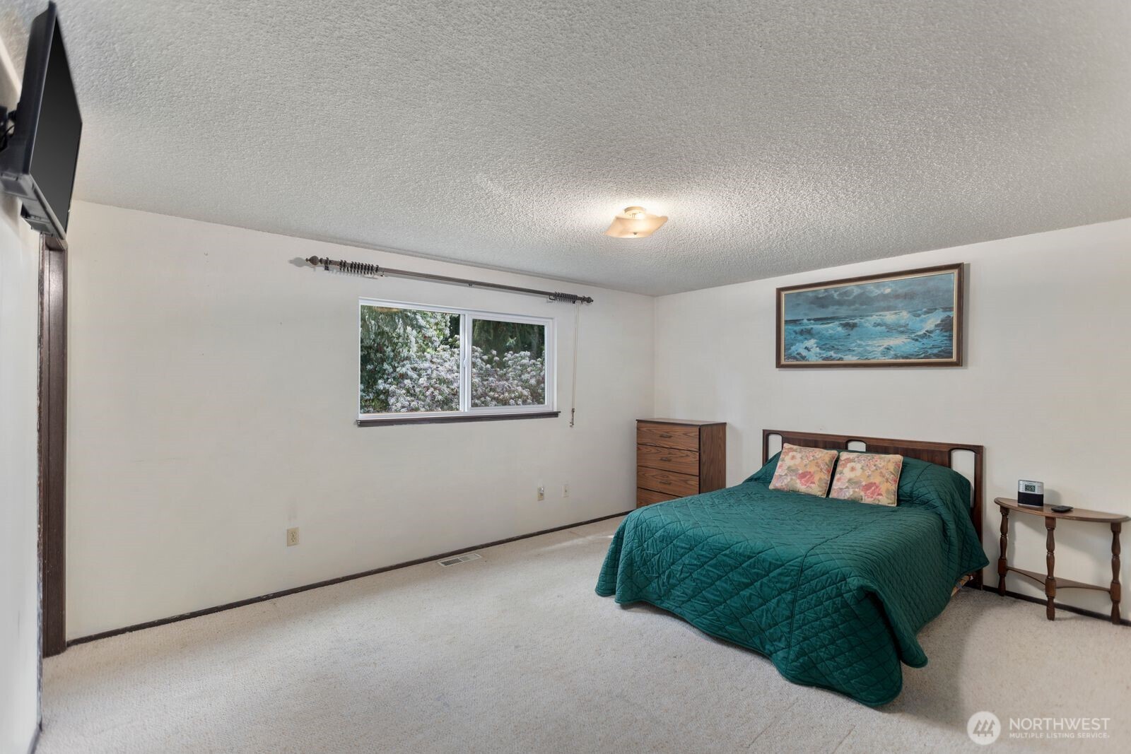 21627 9th Place West Bothell, WA 98021 - Photo 20 of 40 a bedroom with a bed and a painting on the wall