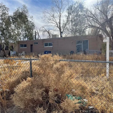 a backyard of house with large trees