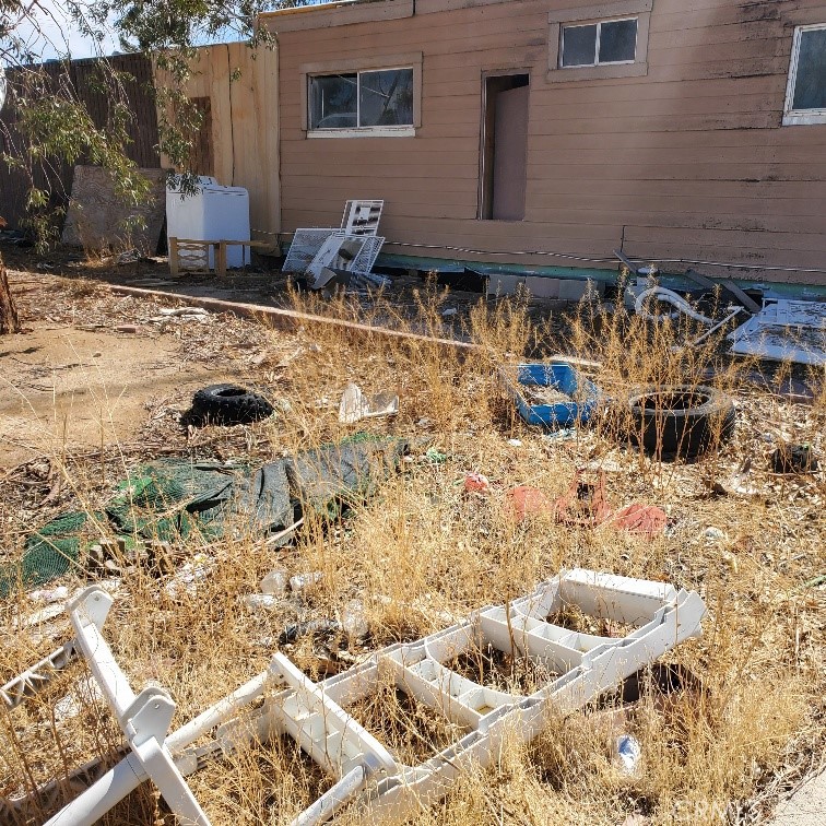 843 Sky Place Ridgecrest, CA 93555 - Photo 6 of 19 a front view of a house with a yard