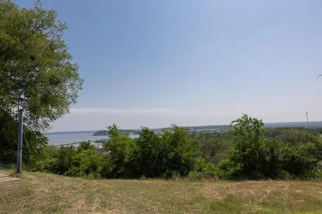 a view of a swimming pool with a balcony