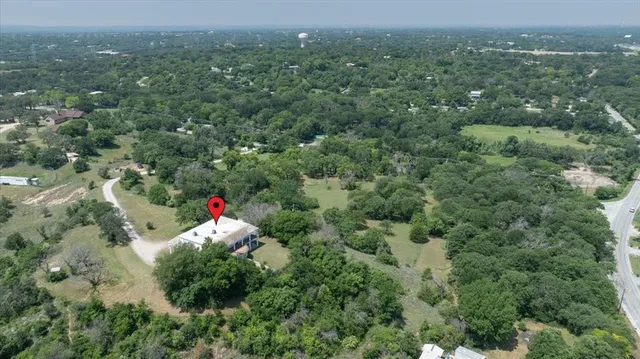 an aerial view of house with yard