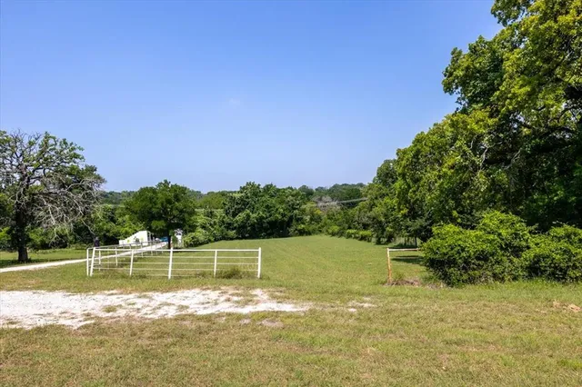 a view of a lake with a yard