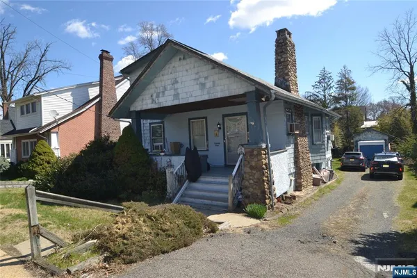 a view of a wooden house with a patio