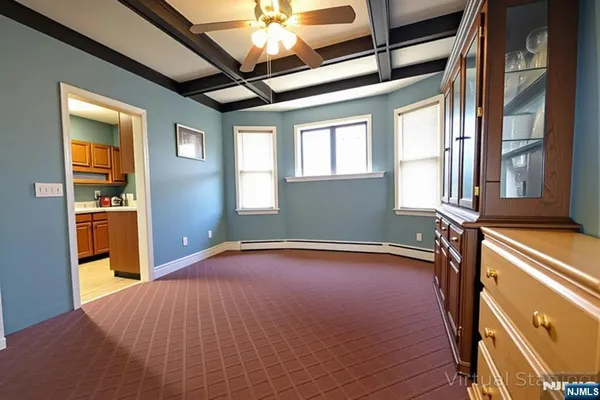 a room with furniture and musical instruments