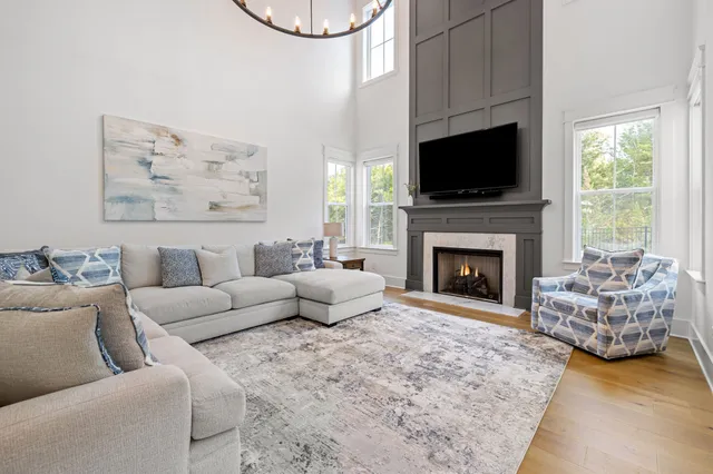 a kitchen with stainless steel appliances kitchen island granite countertop a stove a sink and a refrigerator