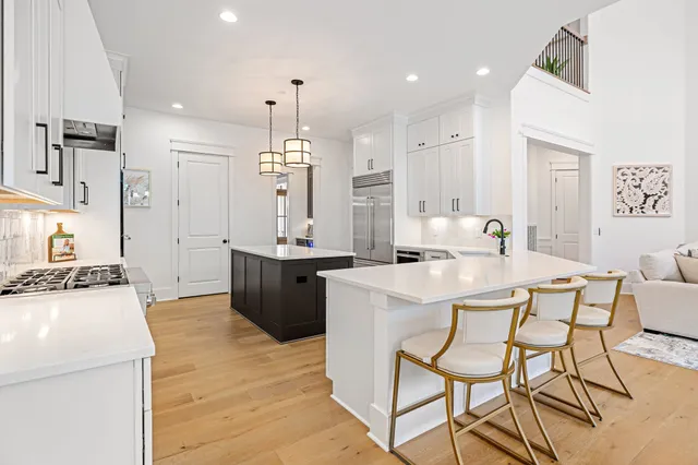 a view of white cabinets with lots of different kinds of food