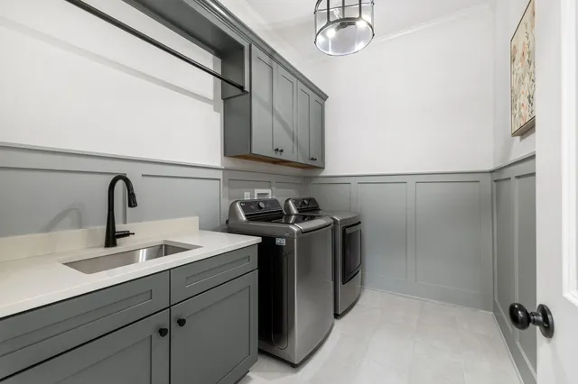 a bathroom with a sink a toilet and a shower