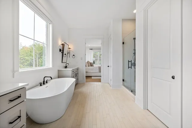 a view of a house with backyard porch and sitting area