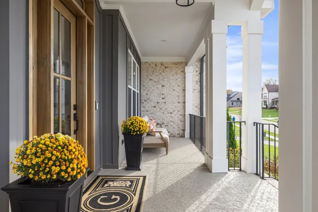 a view of an entryway with wooden floor and windows