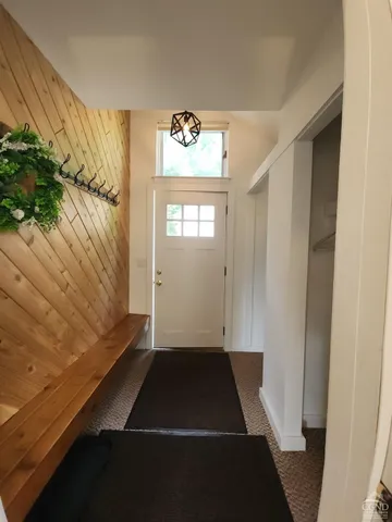 a view of a door and chair in a room