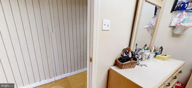 a bedroom with a bed and a mirror