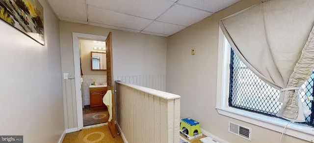 a bathroom with a shower and a sink