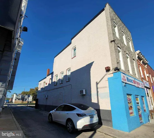 a view of a book shop on a brick wall