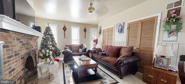 a view of a livingroom with furniture and entryway