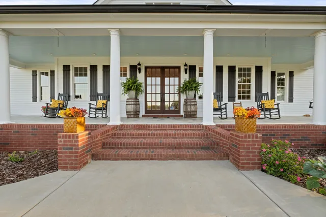 a view of a livingroom with furniture and wooden floor