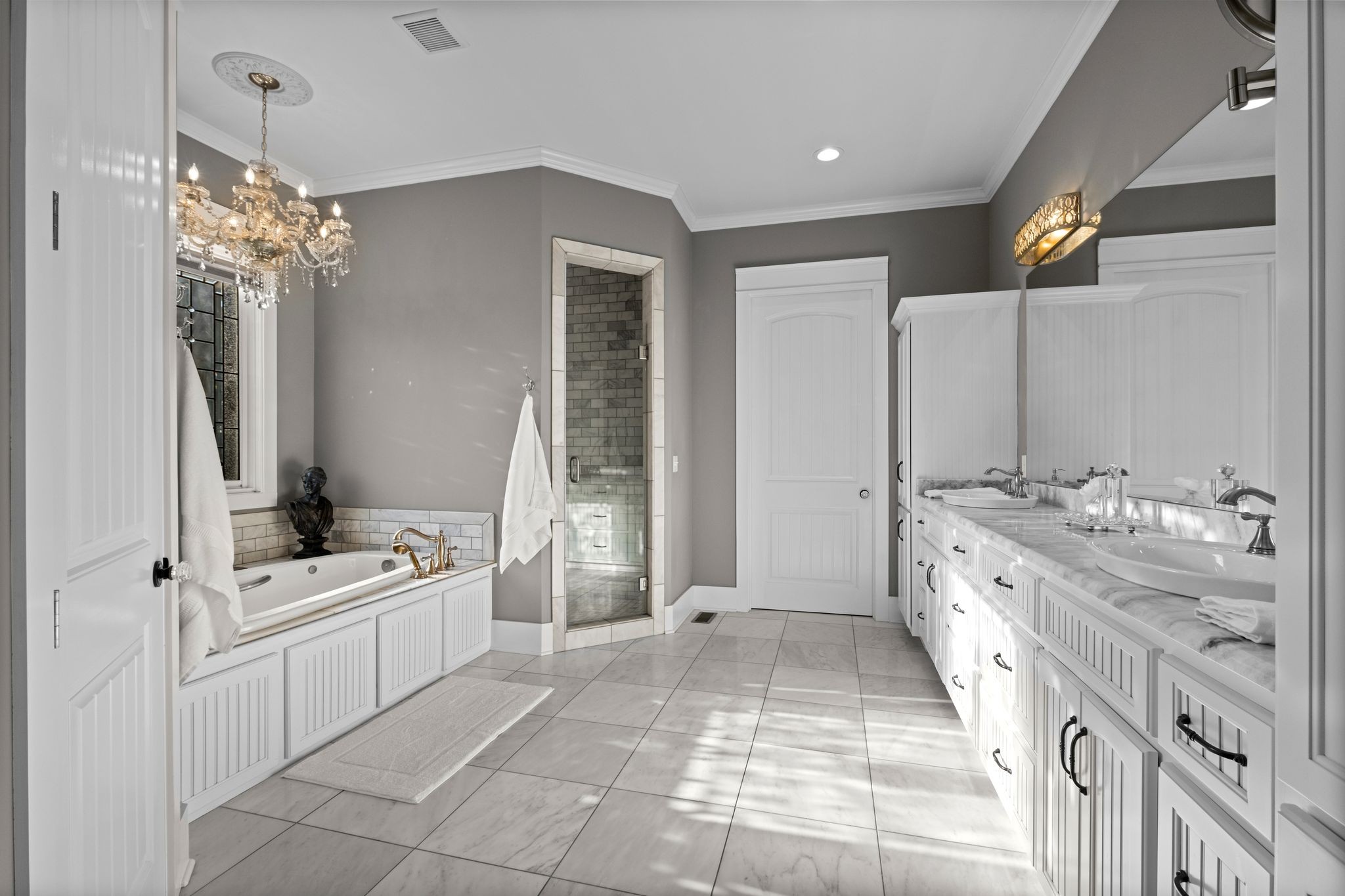 1421 Lawrence Lane Springfield, TN 37172 - Photo 24 of 43 a spacious bathroom with a double vanity sink a mirror and a bathtub