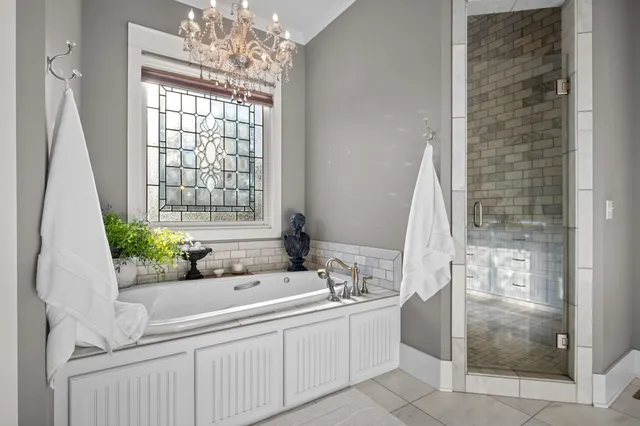 a bathroom with a granite countertop sink toilet mirror and shower