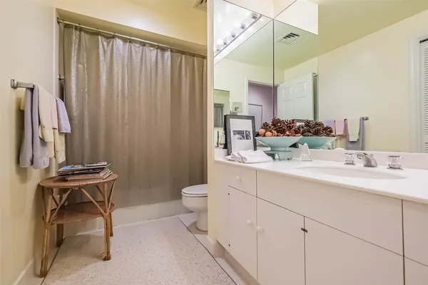 a bedroom with furniture and a baby crib