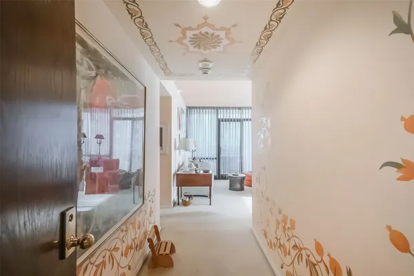 a view of hall way with furniture