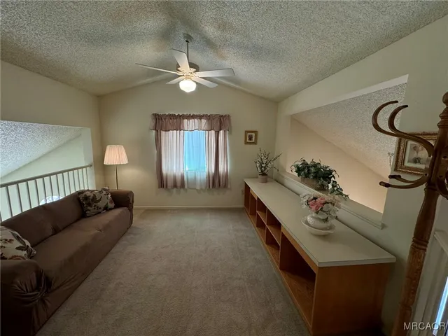 a view of entryway with a window and wooden floor