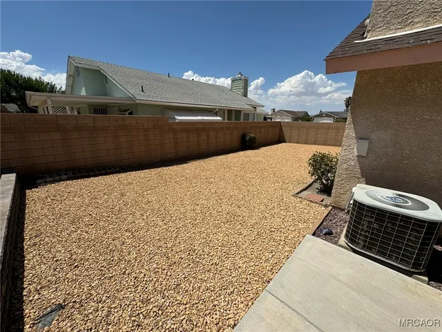 a view of a hallway with windows and stairs