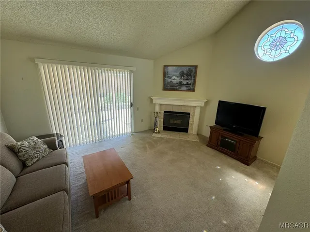a kitchen with stainless steel appliances a stove a sink and a microwave